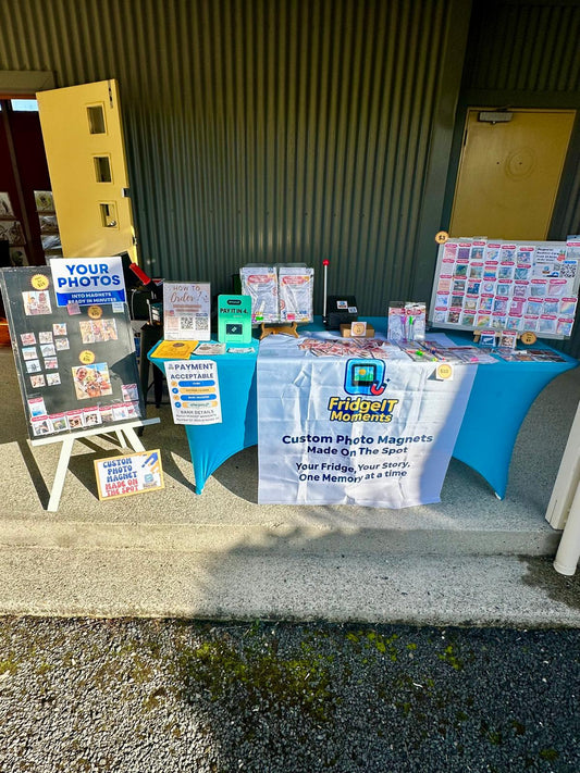 FridgeIT Moments market stall displaying personalised photo magnets and magnetic calendars at Mosgiel Market, New Zealand, DUnedin NZ, Milton NZ,